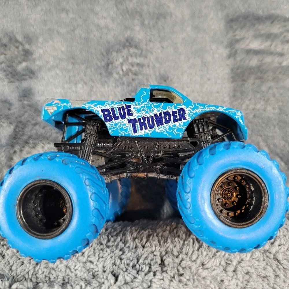 Hot Wheels Monster Jam Blue Thunder and NEA Police 1:64 Diecast Truck Lot of 2